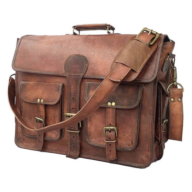 Brown leather satchel bag with gold buckles on a white background
